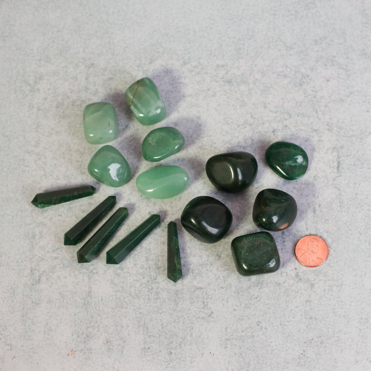 Shades of Harmony Stones next to penny