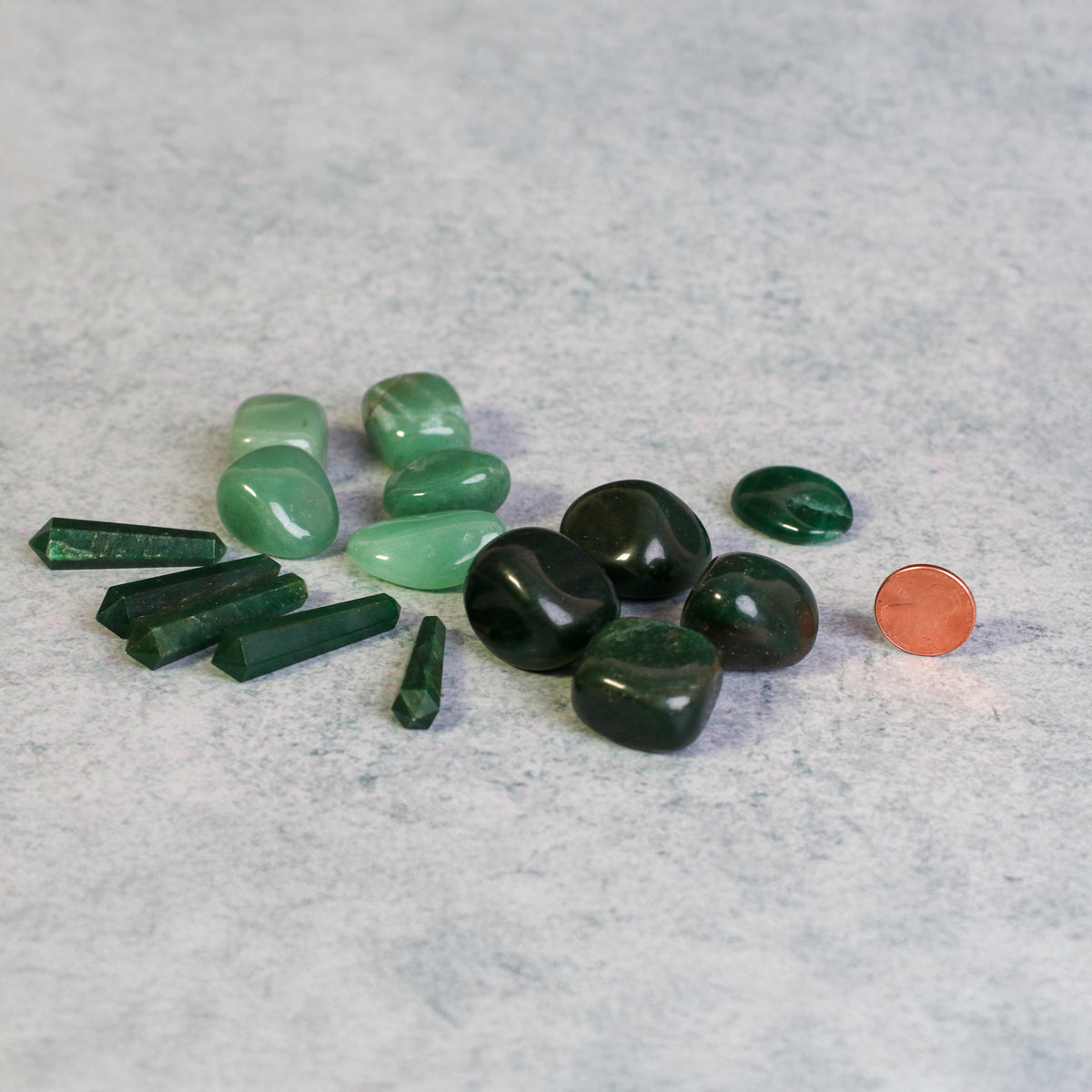 Shades of Harmony Stones next to penny