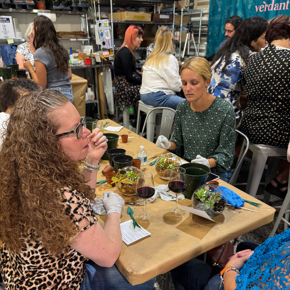 People sitting at a table eating and drinking in a casual setting
